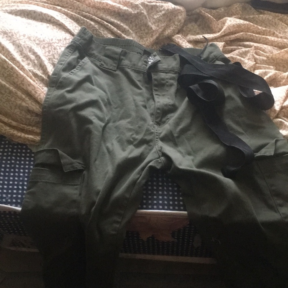 Green jogger pants with black belt